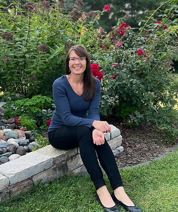 Woman smiling in a garden