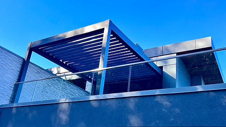 Motorized aluminum louvered pergola installed in the upper patio in Burnaby