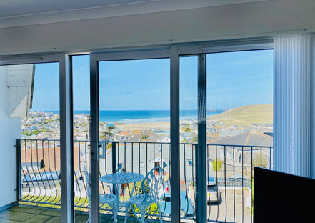 Views from Sea Breeze balcony of Perranporth Beach and sand dunes