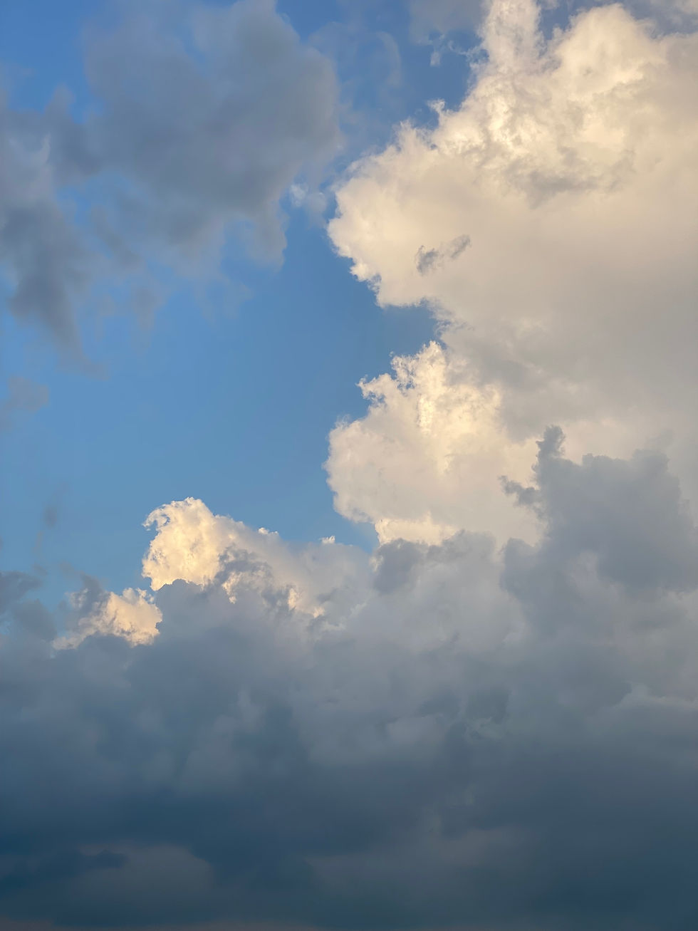 Fluffy white clouds against a blue sky, An Ode to Ordinary