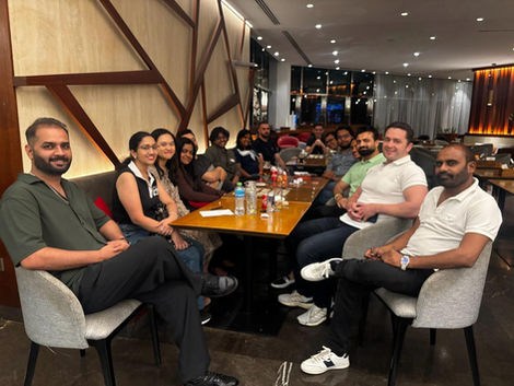 Joyful group sharing a meal, creating Community Event Memories