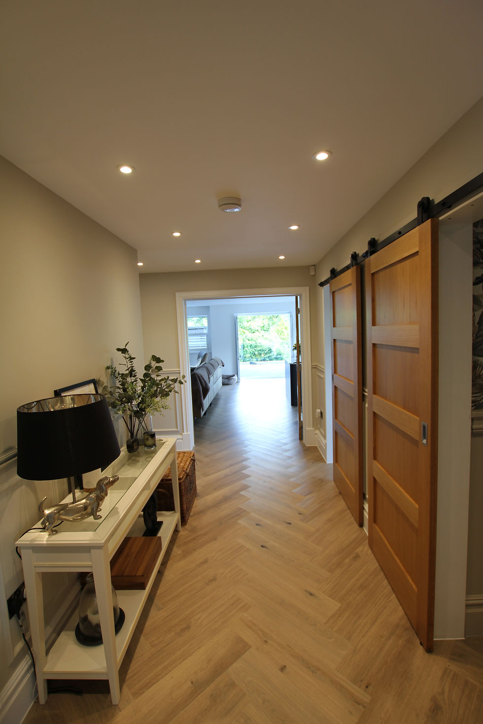 Bright hallway with wide doorways and uncluttered circulation space enhancing accessibility.