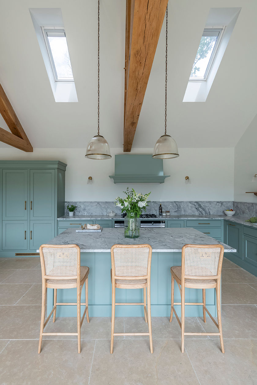 Modern kitchen with roof lights bringing natural light into the centre of the home.