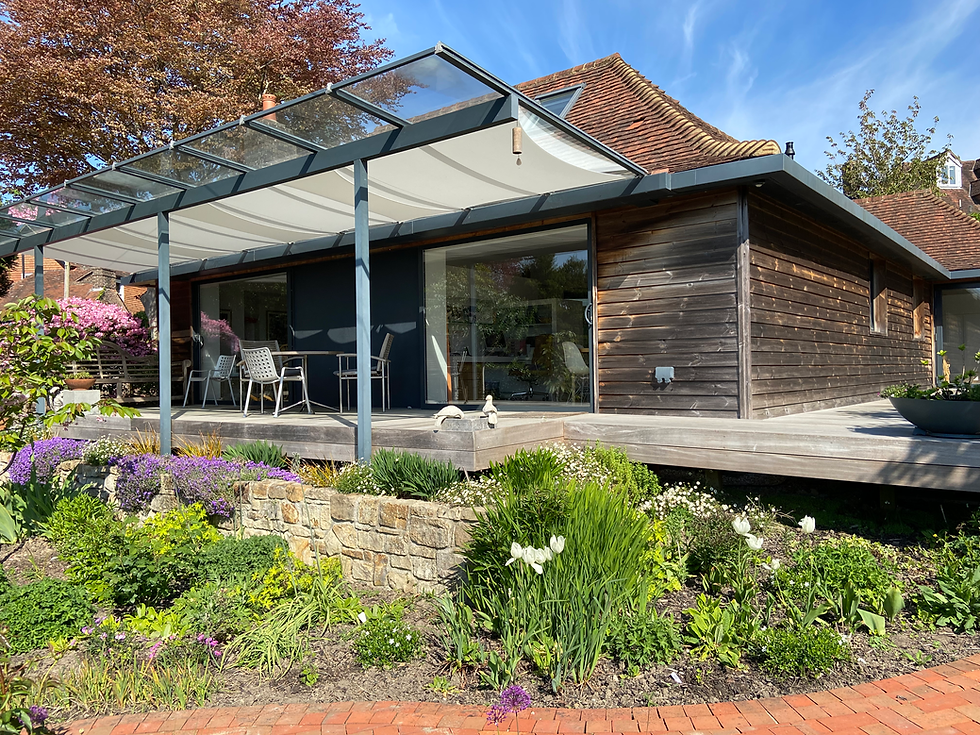 Rear elevation of a residential home showing a carefully designed extension with new windows, demonstrating how even a compact addition can transform a small property