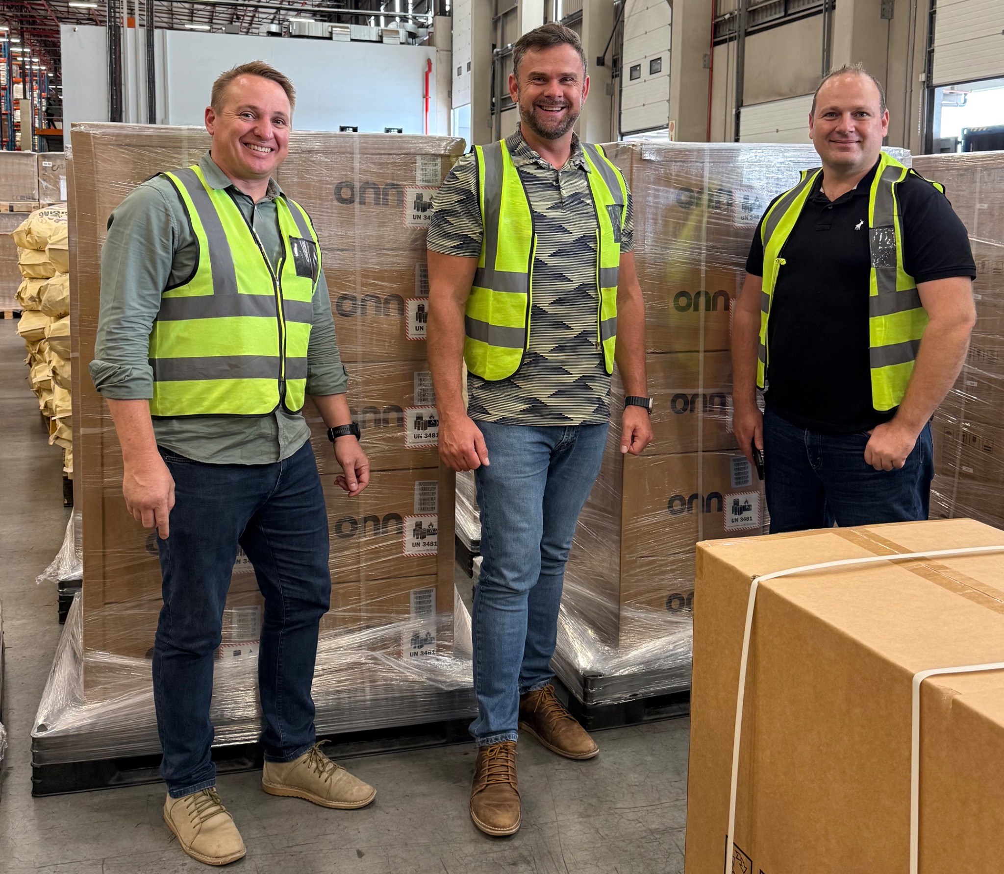 ADG team with ONN stock at the Jet Park warehouse operation.