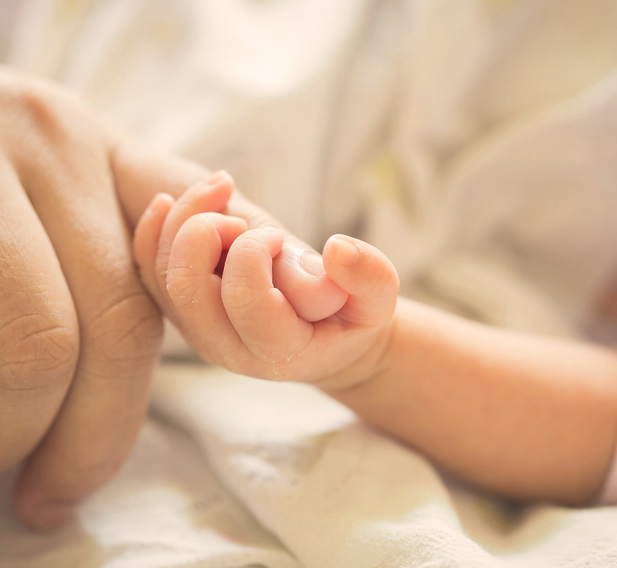 Baby Holding Parent_edited.jpg