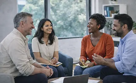 Diverse team in open discussion supporting wellbeing, trust and collaboration