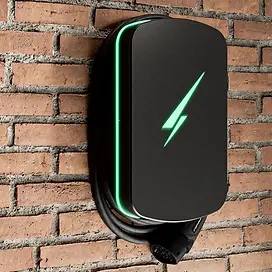 Black Hypervolt EV charger on an exterior brick wall with its cable stored around the unit