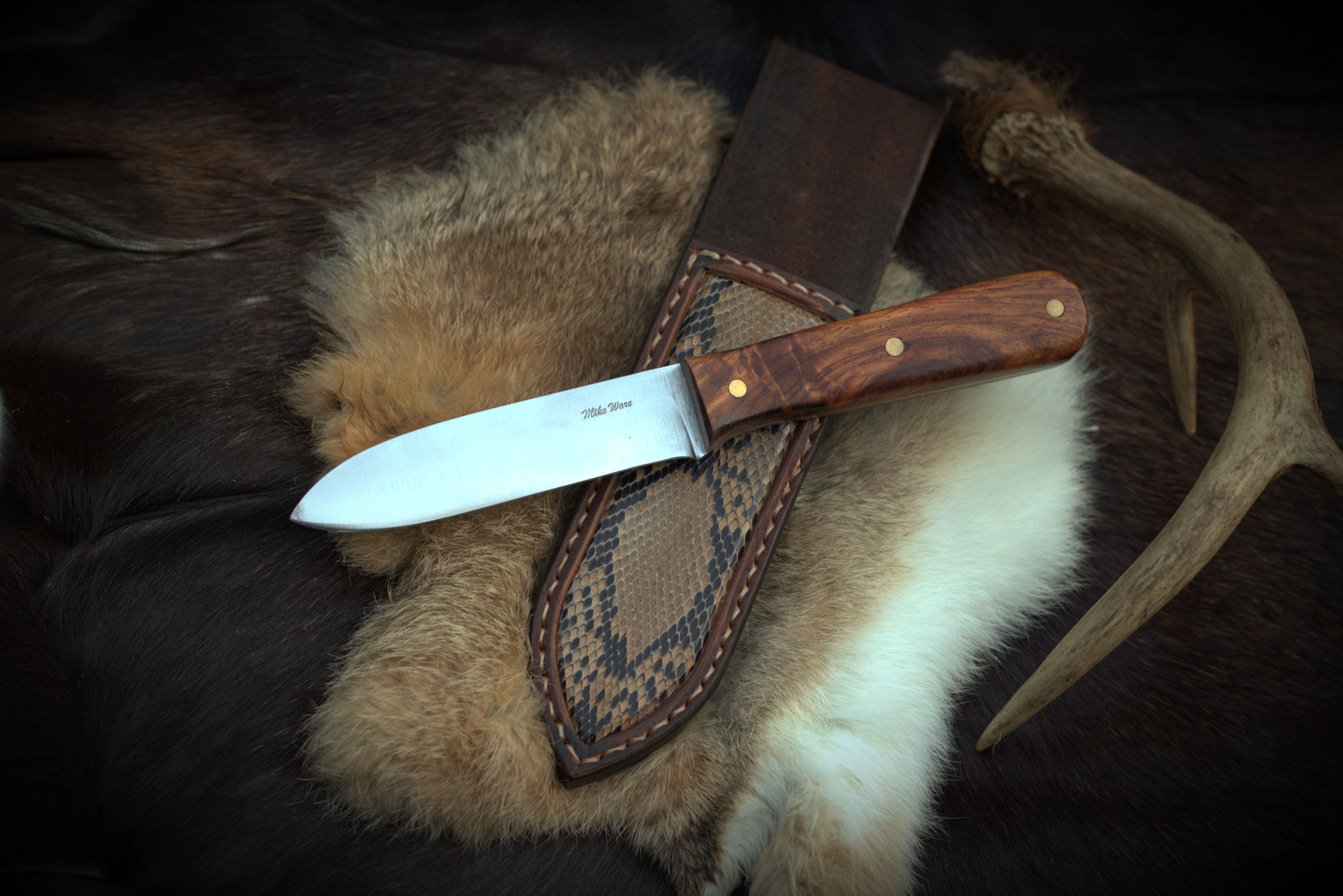Custom kepheart with python skin inlay sheath.