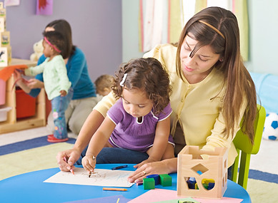 Teacher helping student