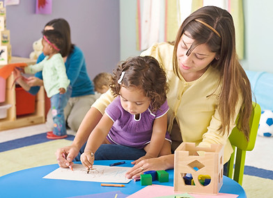 Teacher helping student