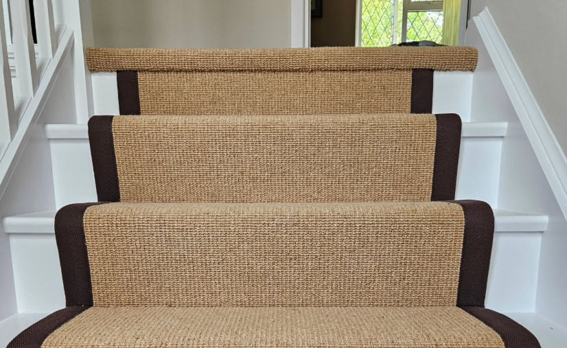 Close-up view of cotton binding tape neatly edging a stair runner