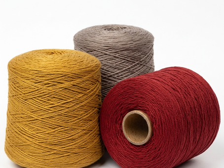 Three spools of Mackenzie Yarns woollen yarn
