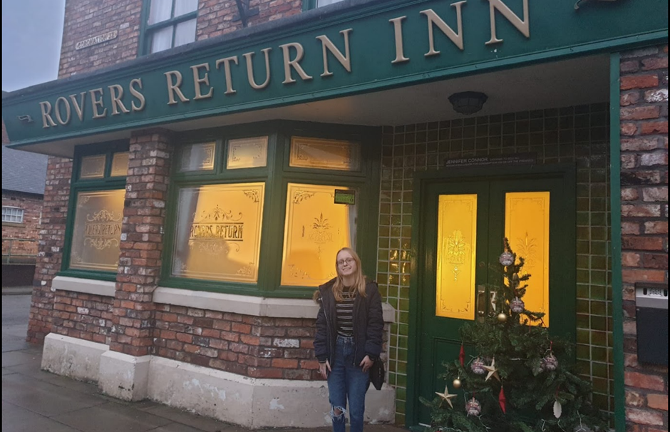A photo of me at the Coronation Street Experience in December 2022 in Manchester, a few weeks after my 18th birthday