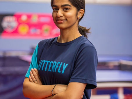 Rise & Rally program lead Lekha Subbaiah posing in a navy athletic shirt at the Austin Table Tennis Club.