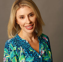 Professional headshot photo of a woman. 