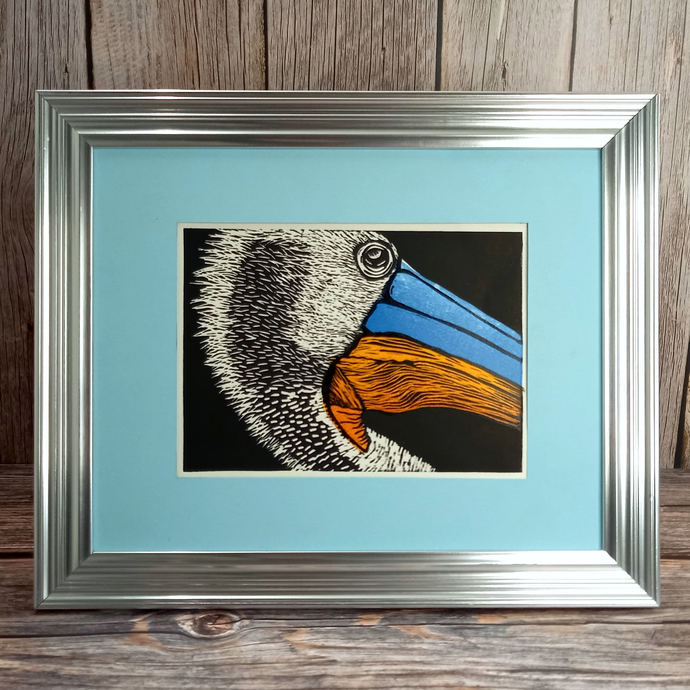 Pelican Head multiblock Linocut print in three colours on black