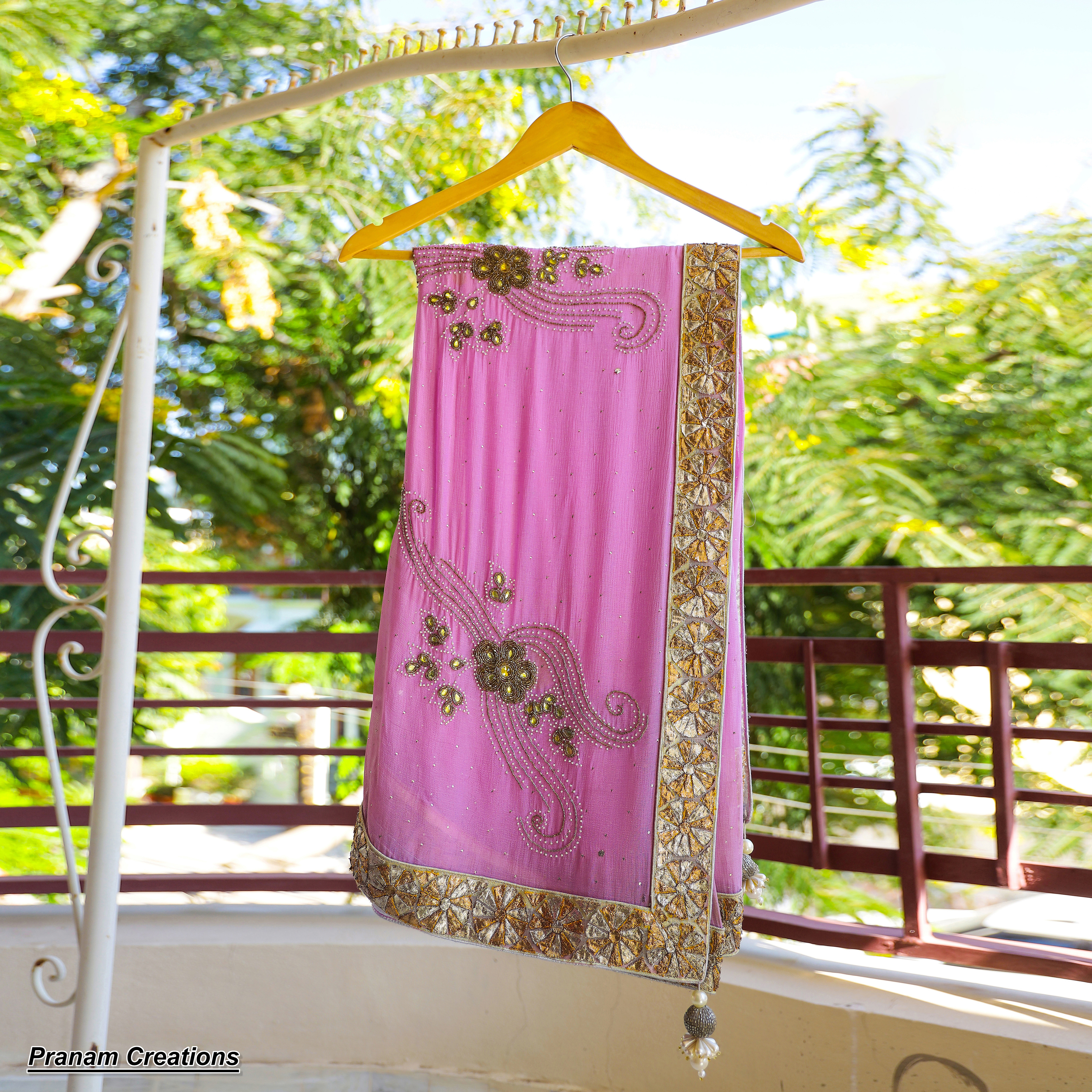 Pure chiffon saree in pleasant pink color, with kerdhana & momia moti work
