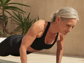 Senior cyclist using wind-resistant hearing aids outdoors