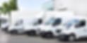 several-vans-trucks-parked-parking-lot-r