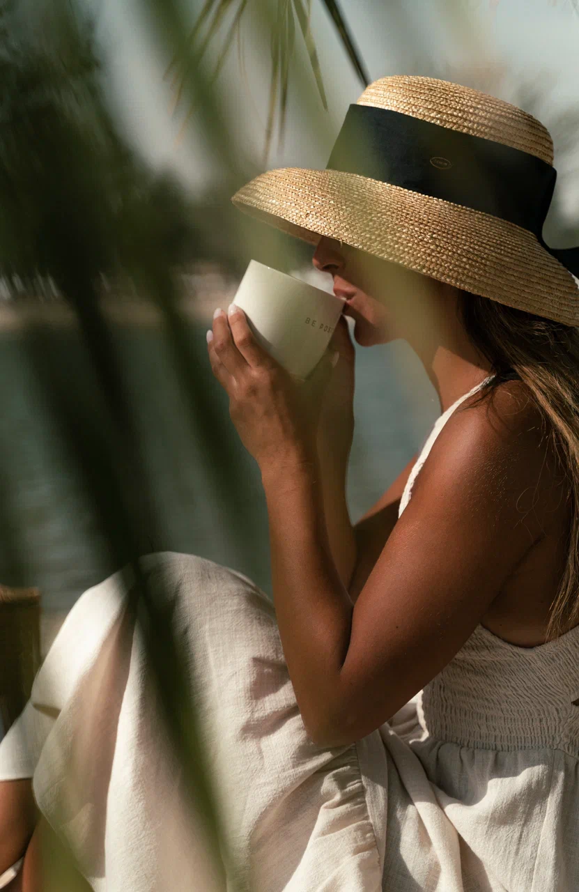 PicnicTimes curated picnic setup with woven basket, natural décor, and fresh juices by the lake.