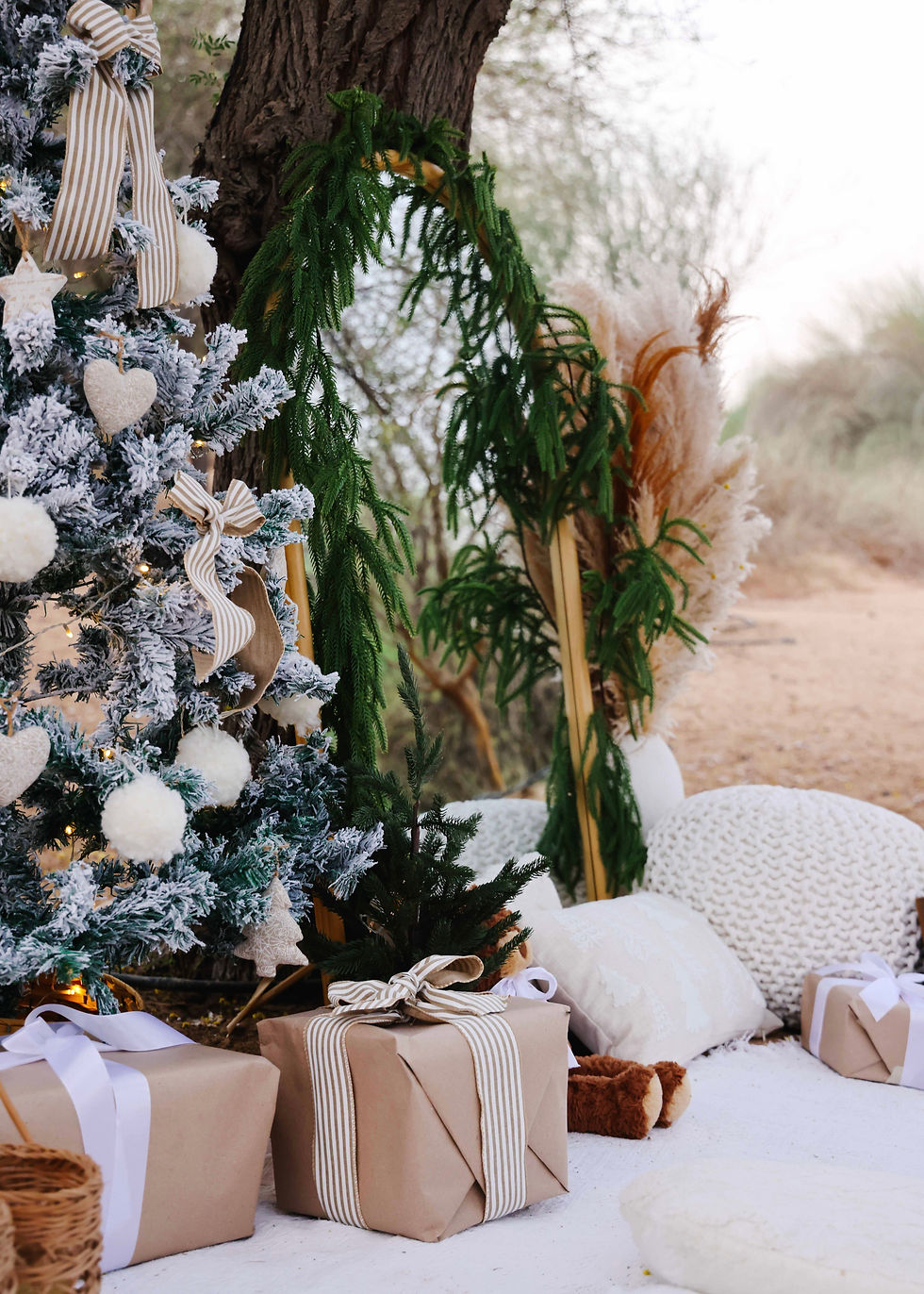 Festive luxury picnic experience in Dubai surrounded by soft cushions, woven textures, and natural decor