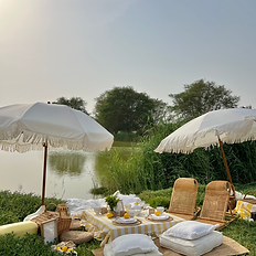 Celebrate the season with a luxury lakeside picnic in Dubai, featuring handcrafted décor, vibrant seasonal florals, gourmet bites, and a tranquil outdoor setting for unforgettable memories