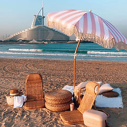 An exclusive Dubai luxury picnic styled against the world famous Burj Al Arab, designed as the city’s most Instagrammable breakfast experience with elegant details, gourmet flavors, and unforgettable views.
