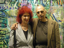 Barbara Romain with her husband Chris Peditto before her artwork Thomas Guide