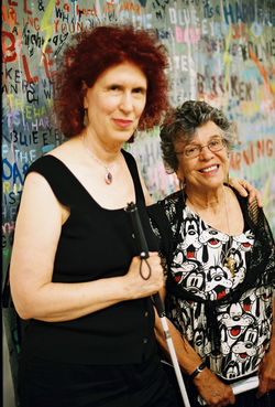 Barbara Romain and Diana Zlotnick before her artwork Hard Rain