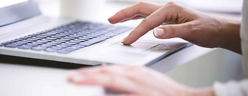 Pincus-Solutions-typing-on-laptop