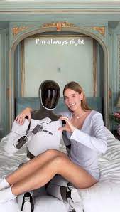 A women and a sex robot are in the picture