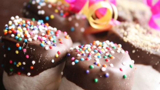 chocolate coated marshmallows adorned with brightly colored sprinkles