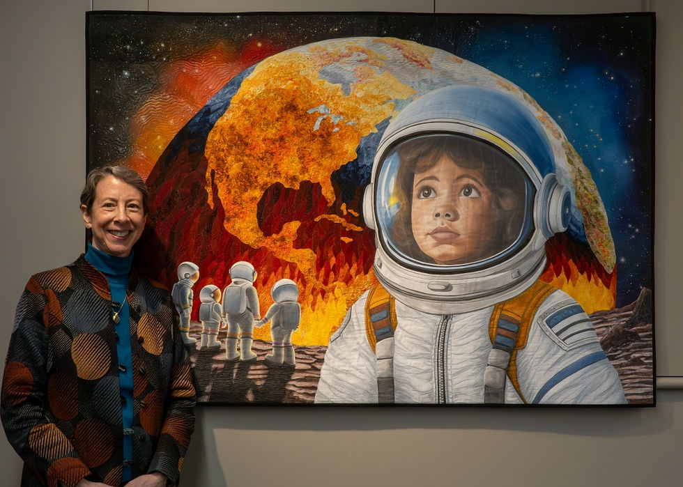 Dale Stuart with her piece "What Was Earth Like, Mommy?"