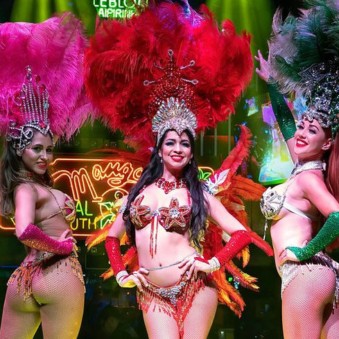 The night explodes with color and rhythm at Mango's Tropical Café in Miami — where feathers, flair, and fiery performances light up South Beach in true Latin style.