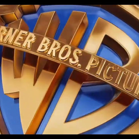 The iconic Warner Bros. Pictures logo — now at the center of Hollywood’s biggest bidding war, with Paramount, Netflix, and Comcast circling the studio giant in a high-stakes media showdown.