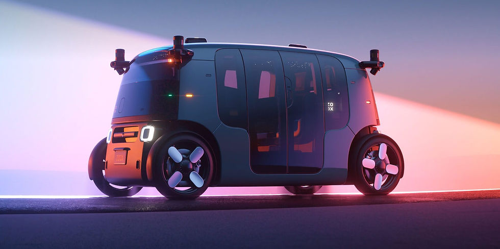 Three-quarter view of a Zoox autonomous robotaxi with dark bodywork, large windows, sliding doors, four wheels, and corner-mounted sensors illuminated by blue and pink light.