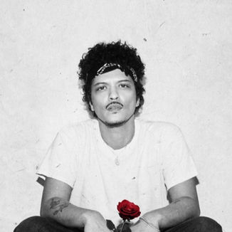 Black-and-white tour poster of Bruno Mars sitting against a textured wall, holding a single red rose, with red text reading “Bruno Mars: The Romantic Tour” and European tour dates listed below.