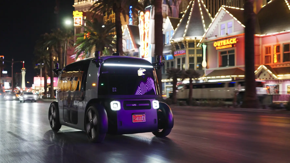 Discover Zoox, Amazon’s futuristic all-electric robotaxi with no steering wheel, no pedals, bidirectional driving, and a lounge-like cabin. Here’s how Zoox works, where you can ride it, and why this strange little autonomous pod may redefine luxury transportation.