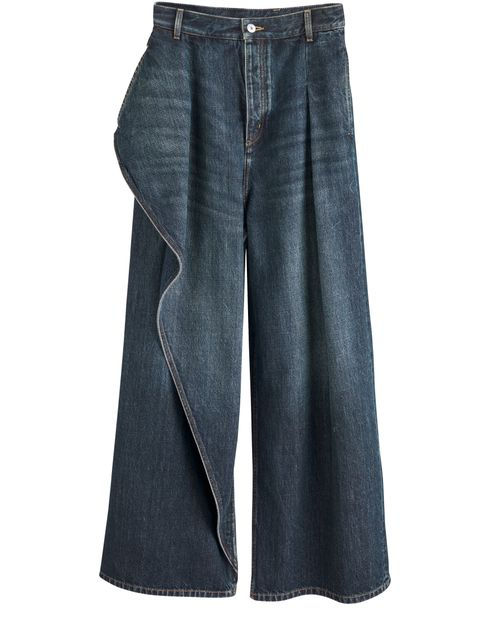 Dior dark blue wide-leg denim pants with front pleats, belt loops, button closure, and an asymmetric draped panel on one side against a white background.
