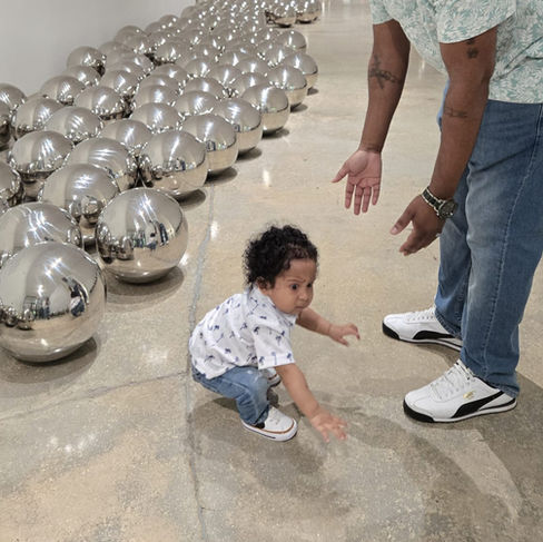 This editorial follows Dennis—self-described “immersive art extremist”—and his family as they toured Superblue Miami and the Rubell Museum. Through the reactions of their one-year-old son, the piece contrasts immersive, sensory-driven installations with provocative contemporary art, revealing the tension between instinct and interpretation. The experience also reflects on the visionary creatives behind Superblue, who connect to Beyoncé’s Renaissance World Tour and the Sphere in Las Vegas. (Full galleries included)