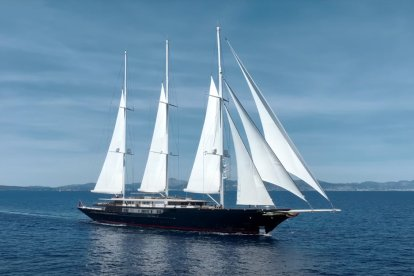 Jeff Bezos Koru yacht, luxury three-mast sailing yacht owned by billionaire, sailing on open sea.