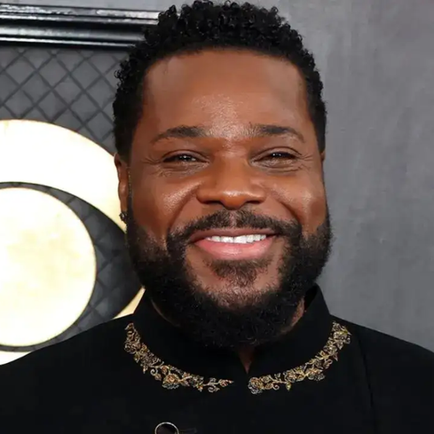 Malcolm-Jamal Warner at one of his final public appearances, radiating warmth and wisdom—just as he always did, from Theo to podcast trailblazer.