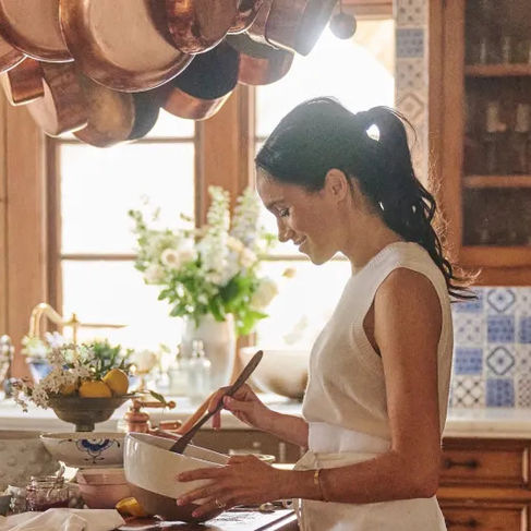 Meghan Markle in her rustic-chic kitchen, stirring up something sweet for her lifestyle brand, American Riviera Orchard.
