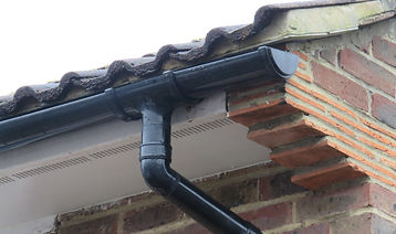 Black rain water guttering running outlet.jpg