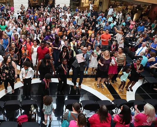 Rodney Eric Lopez leads hundreds of people in an enjoyable line dance at the Miromar Design Center in Estero, FL.