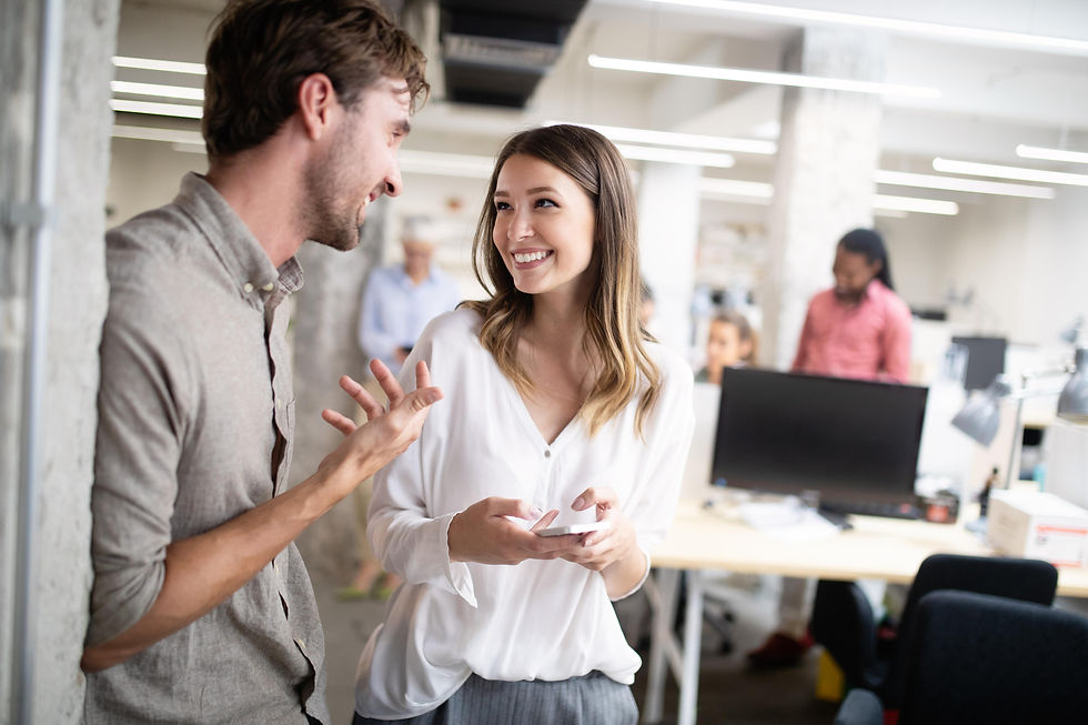 Employees having a positive conversation in a modern workplace