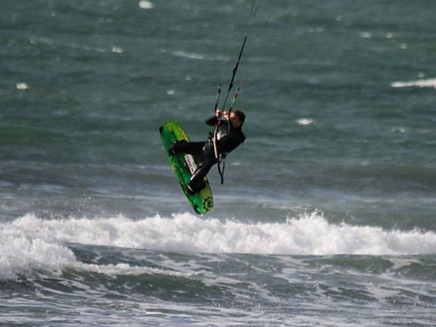 Kitesurfer doing some tricks at Westward Ho! beach in Devon, SW England