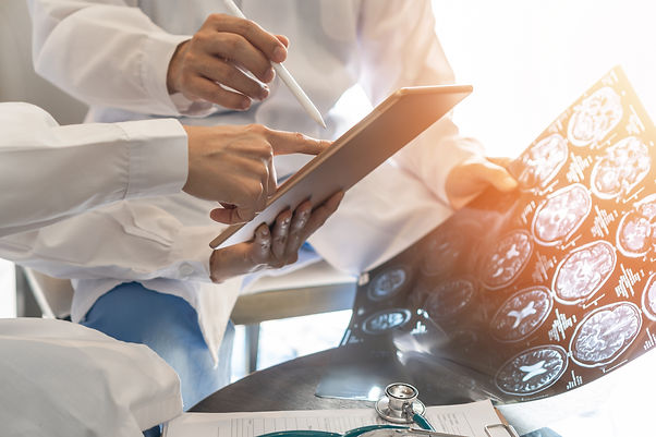 image of doctor reviewing brain imaging