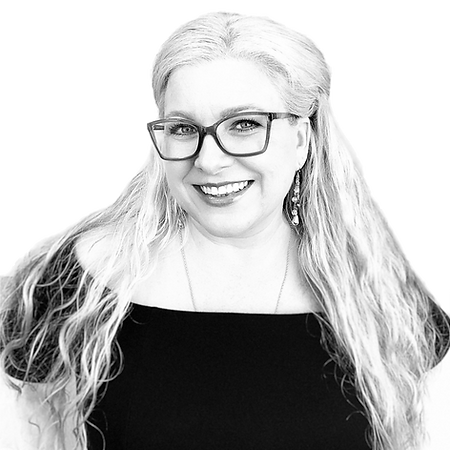 Black-and-white founder portrait wearing glasses